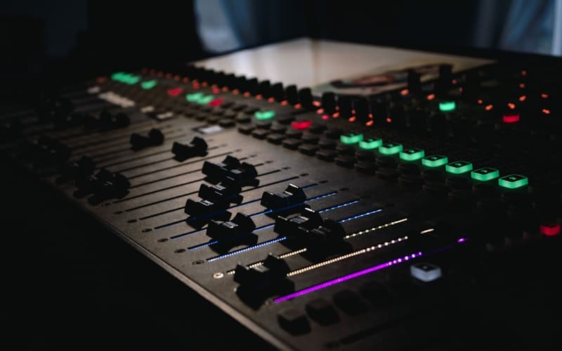 Dark mixing console with illuminated controls